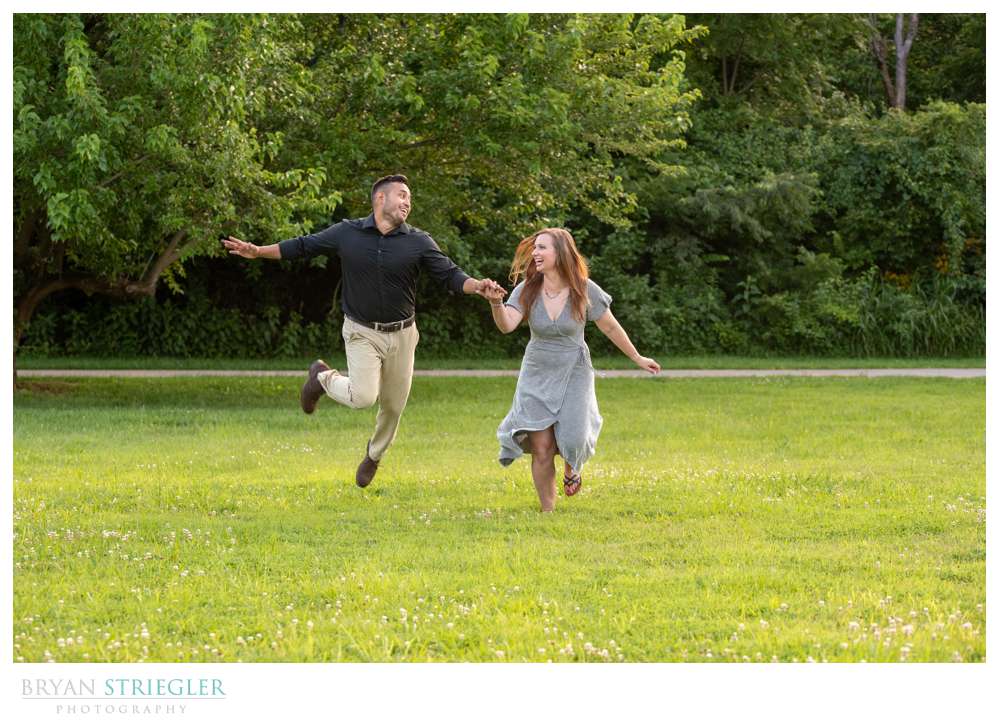 funny couple running through a field